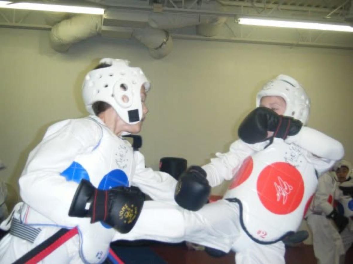 Brianna Kristin sparring as a young Taekwondo student