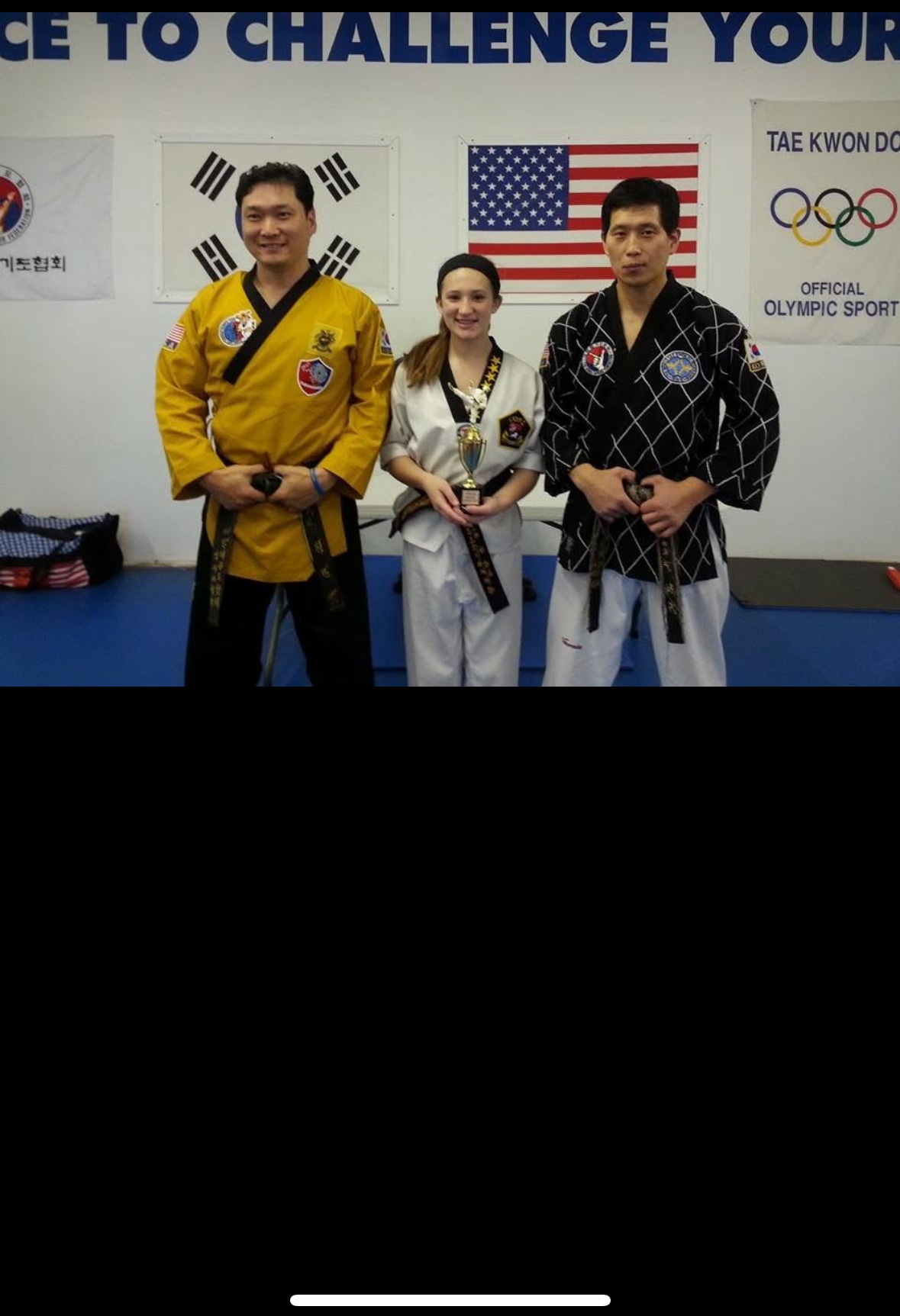 Brianna Kristin as a young girl earning a martial arts trophy