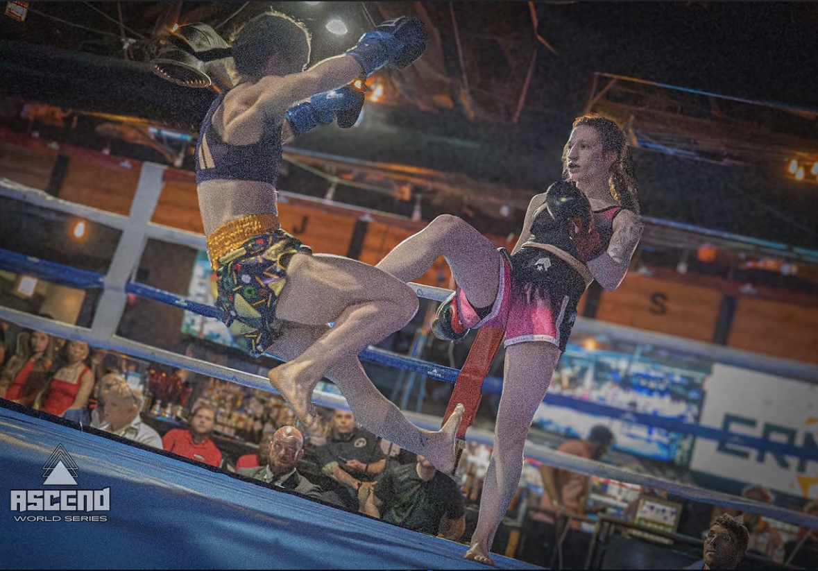 Brianna Kristin throwing a kick in a Muay Thai fight